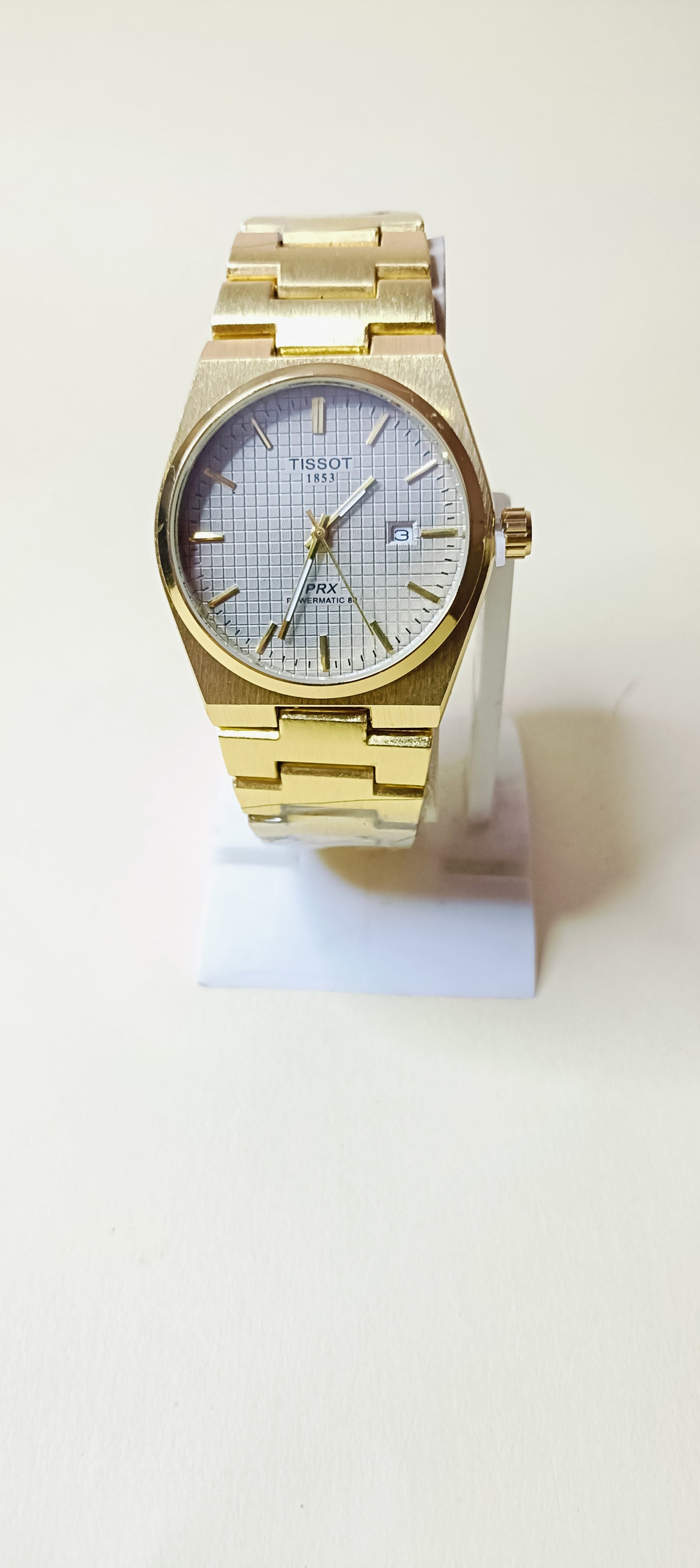 Tissot watch golden with white dial